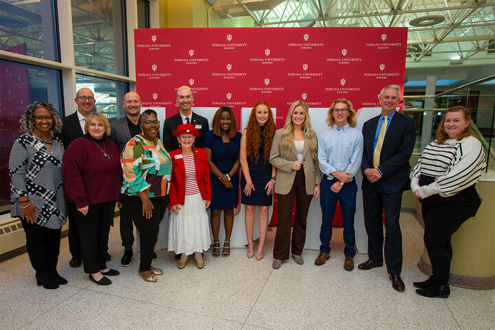 A group portrait of IU Kokomo leaders, alumni board representatives, and alumni board scholarship recipients.